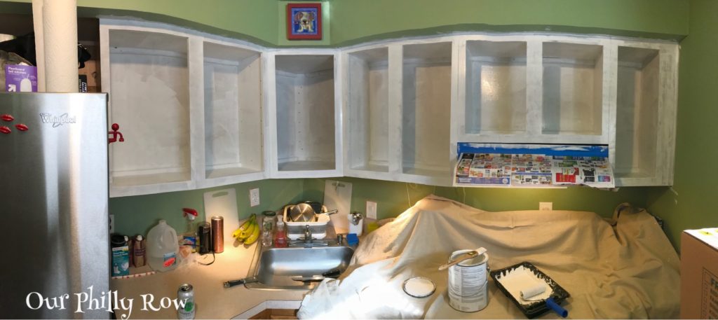Primer on the uppers completed. The doggy clock at the top was left behind by the previous owner... It is totally not our style, but we both love it.